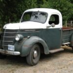 parked white and grey pickup truck